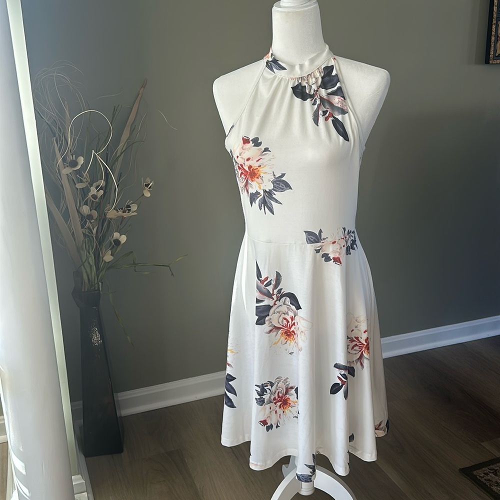 Women’s Sleeveless, High Neck white and floral dress. Size Small.